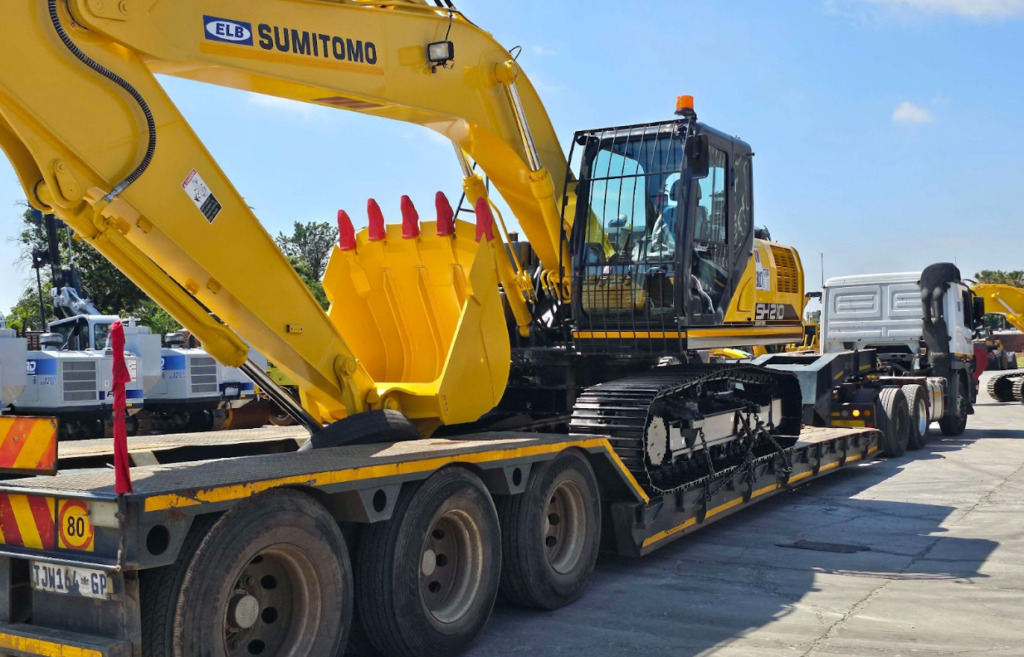 Excavator loaded on a lowbed trailer