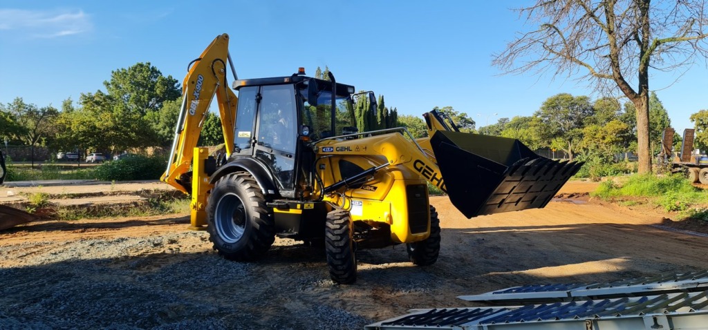 TLB parked on a gravel site